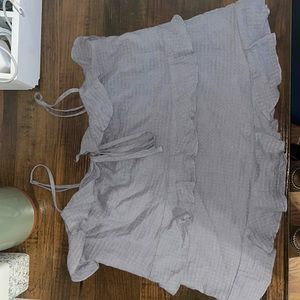 A purple tank top with ruffles